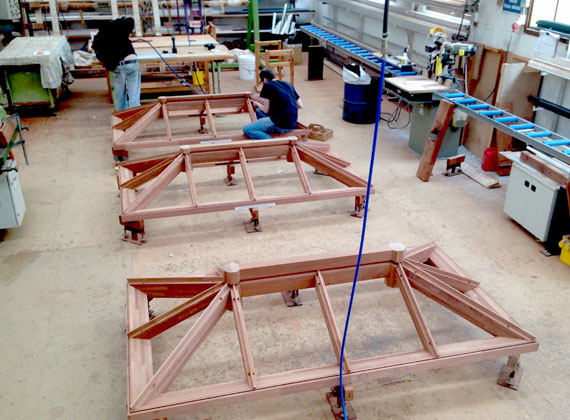 A photograph of Heritage series roof lanterns being assembled at the Tuck's Wood factory in Norfolk, England