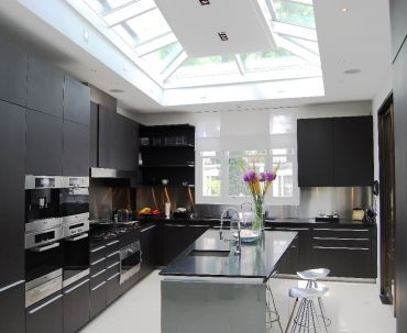 Photo of a bespoke wedge-shaped roof lantern with central flat roof section