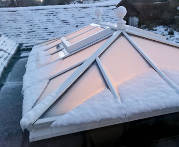 Photo of a bespoke triple-glazed roof lantern in the depths of winter