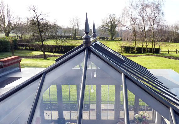 Photo of a large, non-standard roof lantern with spire ornamental finials
